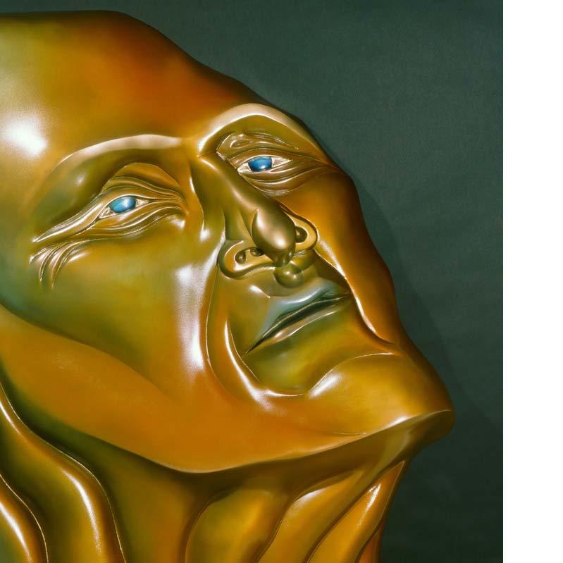 Relief sculpture in shades of orange and turquoise of a face with a wrinkled neck looking upward