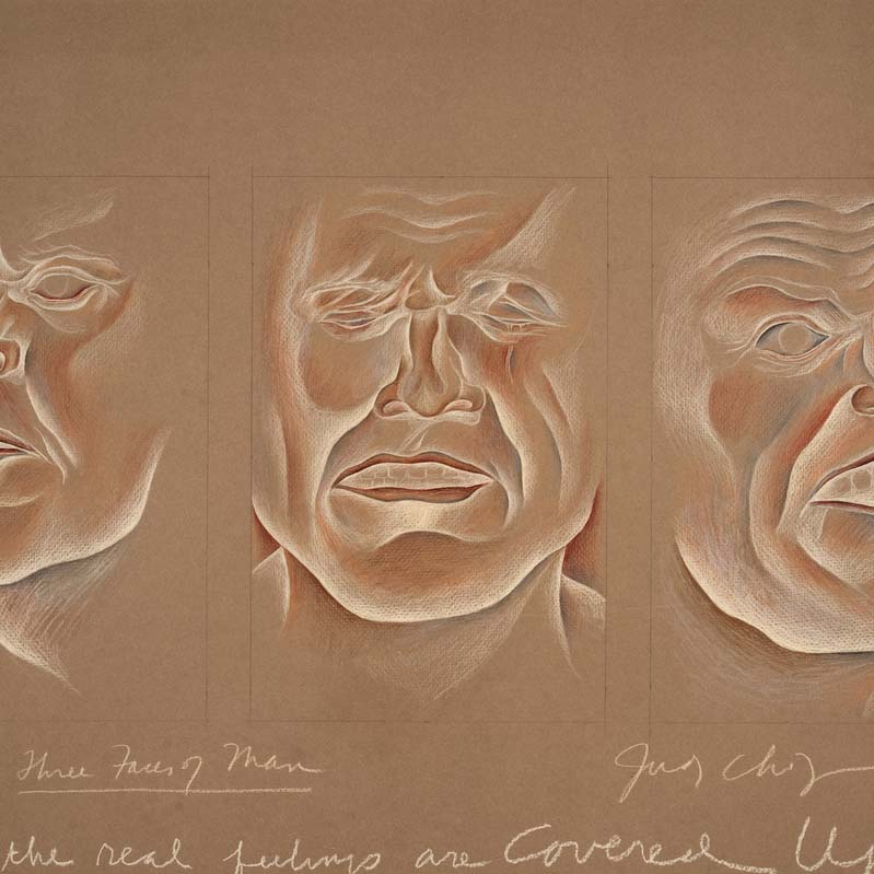 Drawing in shades of white and brown on tan paper of three faces with different expressions annotated with handwriting below