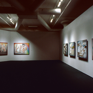 Color photograph of a gallery installation with five large paintings hanging on two adjacent walls