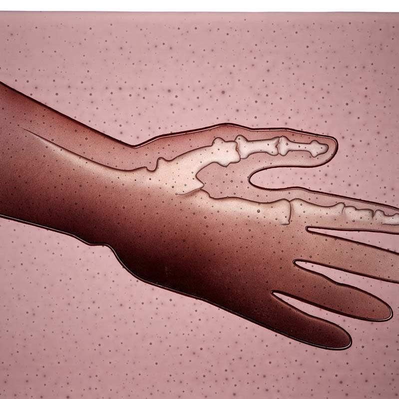 Painting in pink, brown, and white of an outstretched hand with exposed bones