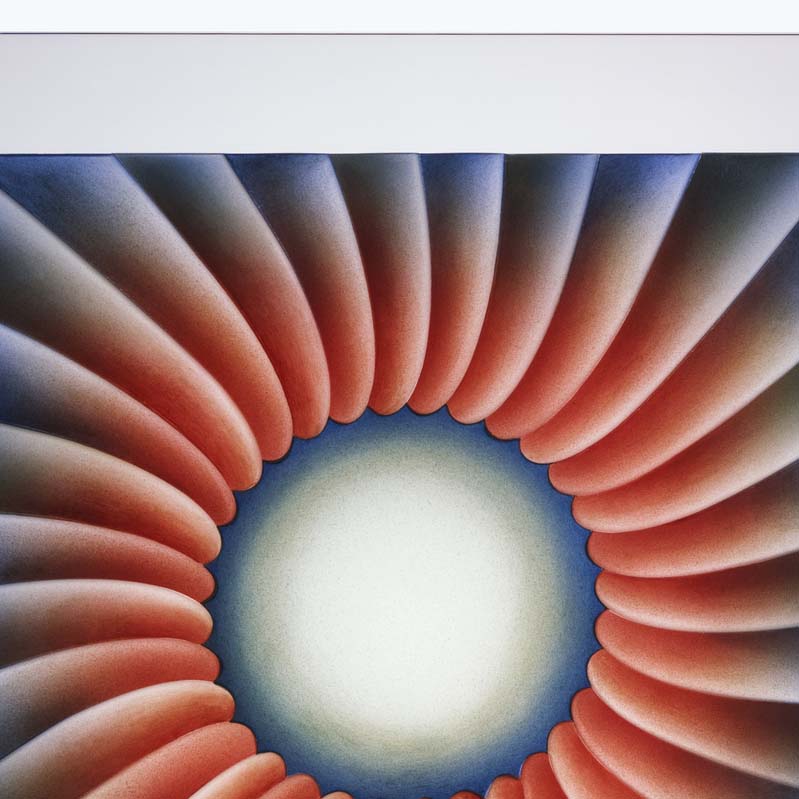 Painting of a ring of petal-like shapes in shades of red and blue