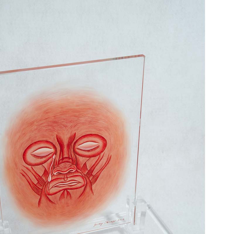 Red painting of a face with exposed musculature on a clear glass rectangle on a clear plinth