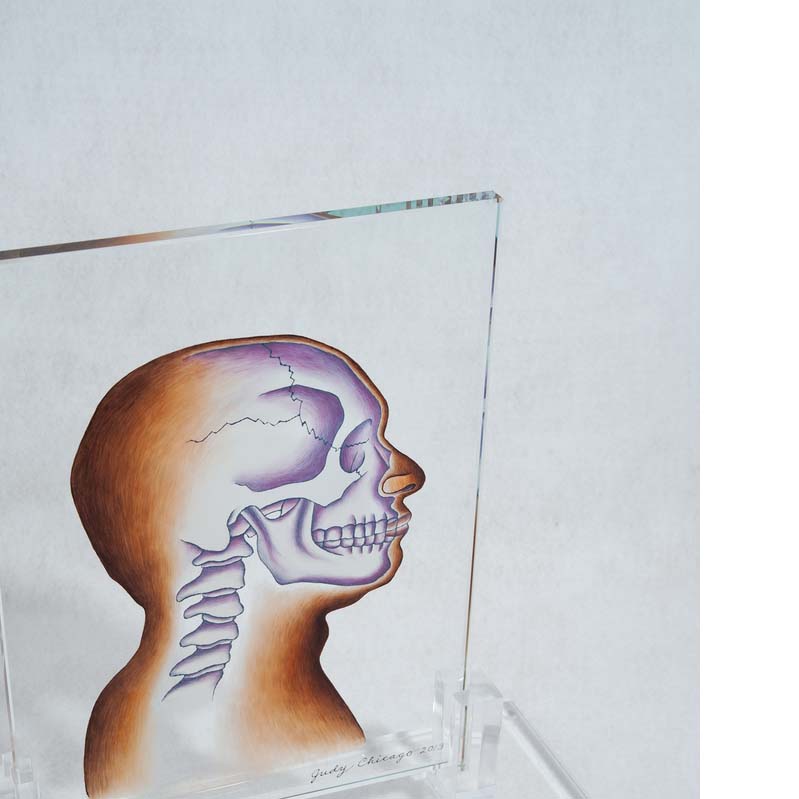 Painting on a clear glass rectangle of a head in profile with the skull exposed on a clear plinth