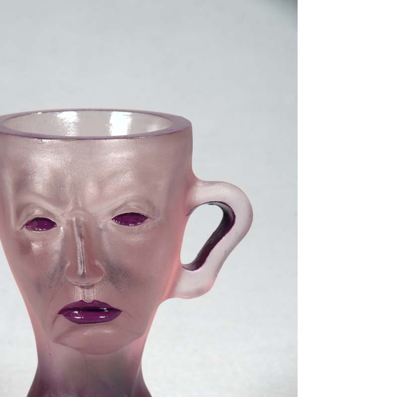Mug in translucent purple with a face, handle, and a flared base