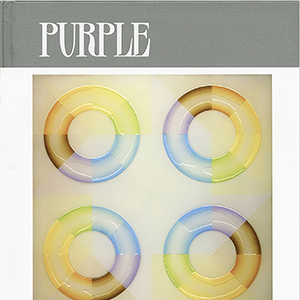 Magazine cover with an artwork of four pastel, multicolored rings